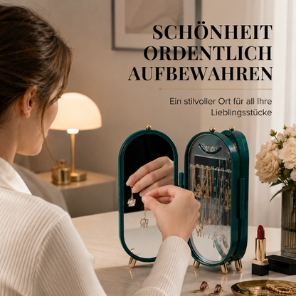 Der elegante Schmuckorganizer mit integriertem Spiegel hält Ketten, Ohrringe, Ringe und Armbänder ordentlich und jederzeit griffbereit. Das moderne Design macht ihn zum stilvollen Blickfang auf jedem Schminktisch.